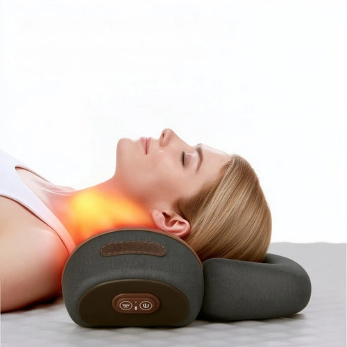 Woman relaxing on the LoftRest cervical traction pillow with the heat mode on
